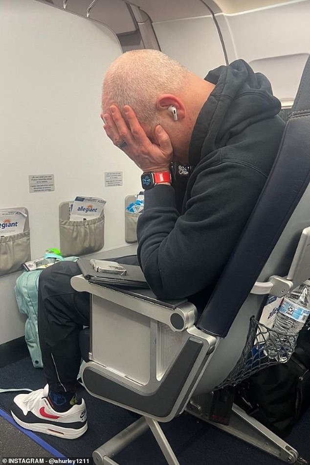 UConn coach Dan Hurley puts his head in his hands, captured by his wife Andrea Hurley.