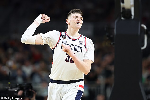 UConn's Donovan Clingan celebrates in the second half.  The big guy finished with 18 points.
