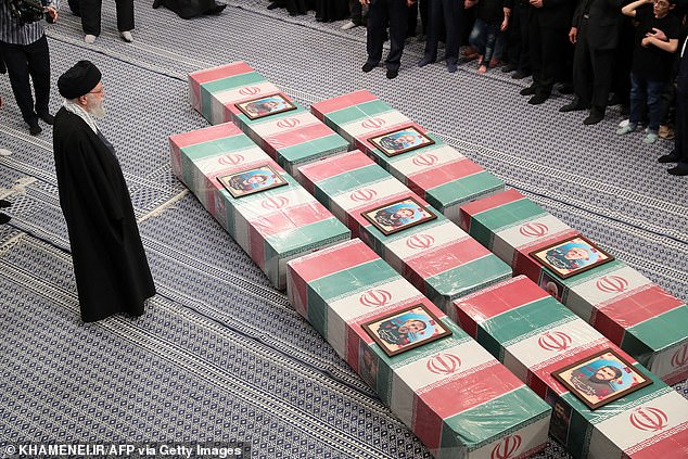 Supreme Leader Ayatollah Ali Khamenei prays at the coffins of seven members of the Revolutionary Guard killed in an attack on Iran's consular annex in Damascus.