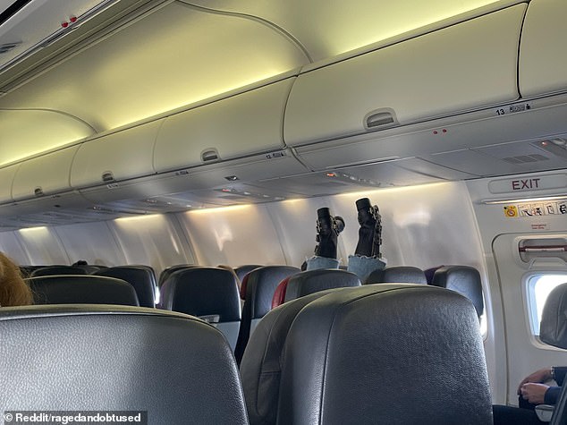 The photo, which appears to be of a person lying on two seats with their feet in the air on a flight from Melbourne to Sydney, has left social media users perplexed.