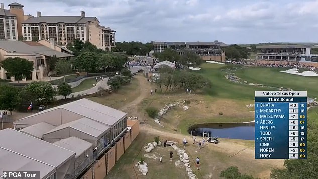 Spieth sent his ball away from the green (above, center) and toward the clubhouse (left)