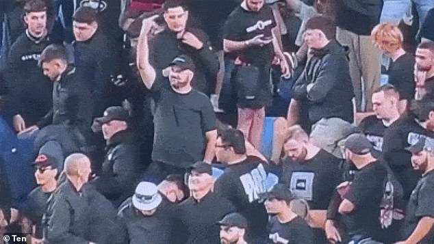 Footage from Channel Ten's coverage of the Sydney derby on Saturday first showed the man giving the middle finger at the rival (pictured).