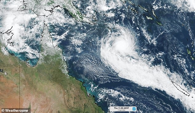 The Bureau of Meteorology reported on Thursday morning that Tropical Cyclone Paul (pictured), currently located east of the Queensland coast, is weakening.