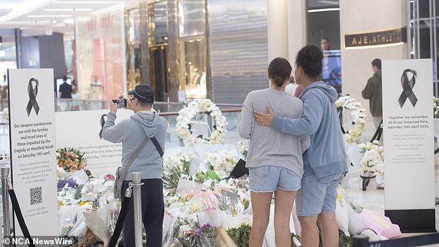 Tributes flow as shoppers return to Westfield shopping center in Bondi Junction a week after stab attack