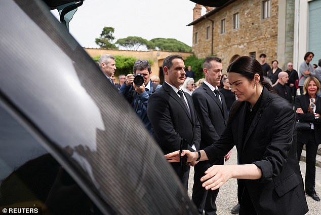 Sandra Nilsson (pictured) appeared heartbroken at her partner Roberto Cavalli's funeral, and appeared to lean towards his hearse.