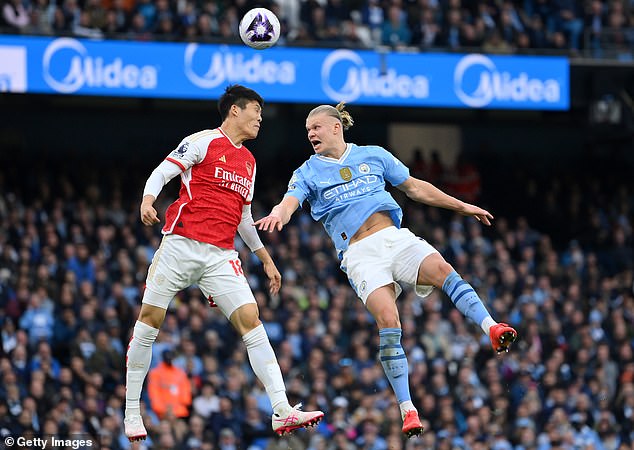 Erling Haaland (right) struggled coming into the game against Arsenal, only taking two shots and less than 30 touches.