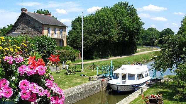 Pure pleasure: Ticky Hedley-Dent enjoys a boat holiday on the canals of Brittany with Le Boat
