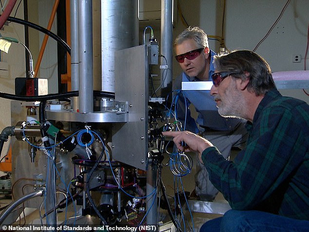 Coordinated Universal Time (UTC) is defined by sophisticated and ultra-precise 'atomic clocks' around the world, which operate precisely and continuously. Shown here are experts with the NIST-F2 atomic clock in the US.