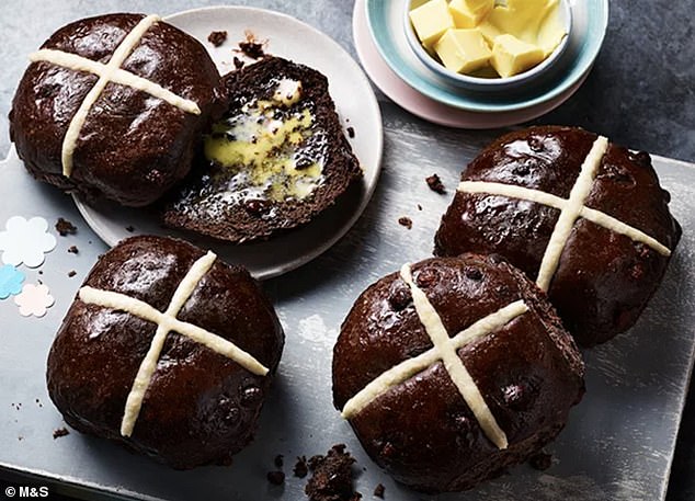 Pictured: M&S's extremely chocolatey hot cross buns, which were introduced to the luxury range this year.