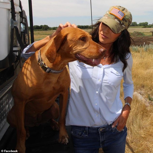 The governor of South Dakota is photographed with another dog she had, Hazel