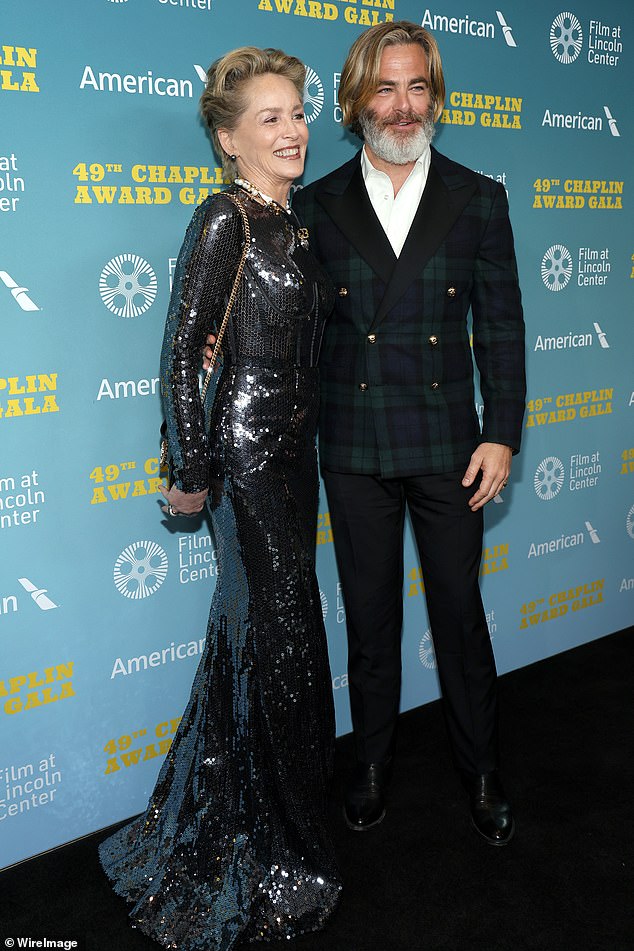 Pine posed with Sharon Stone at the Chaplin Prize Gala this week in New York