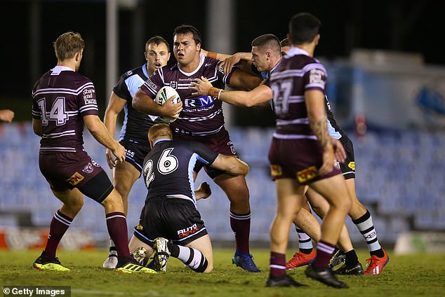 Perrett (pictured carrying the ball for Manly) said he was 