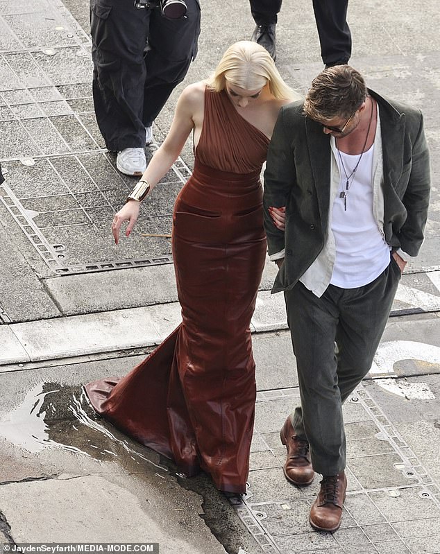 But his brave attempt to escort Taylor-Joy to the waiting car failed when, in his haste, he walked her straight through a puddle, soaking the train of her dress.