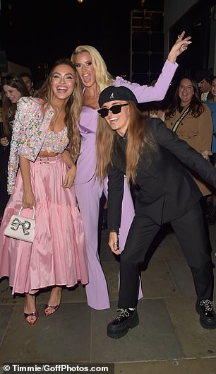 Emma was dressed in a three-piece lavender pantsuit, while Chrishell's former partner, G Flip, wore an all-black pantsuit.
