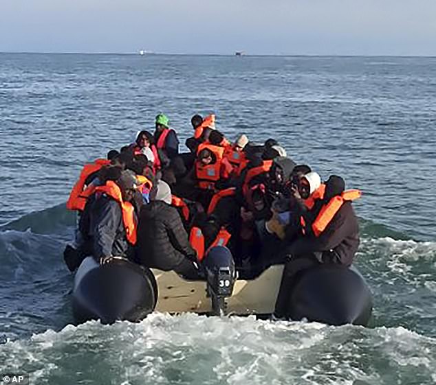 The small, overcrowded boat with 112 people on board briefly ran aground off the northern coast of France at Wimereux, near Boulogne-sur-Mer.  The migrants are seen aboard the ship for the second time, setting off on a successful journey, after the tragedy occurred earlier that day.