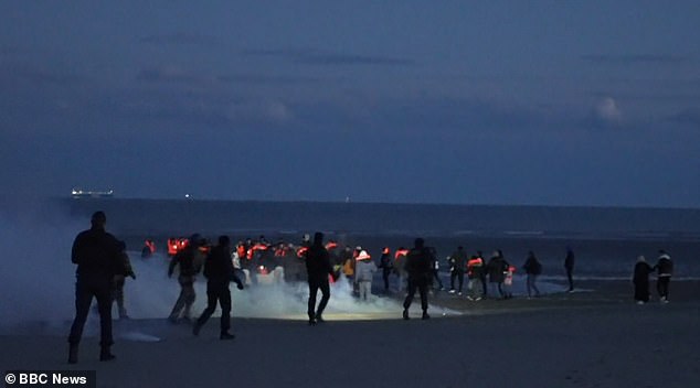Immigrants are seen beating French police using only wooden sticks and firecrackers.