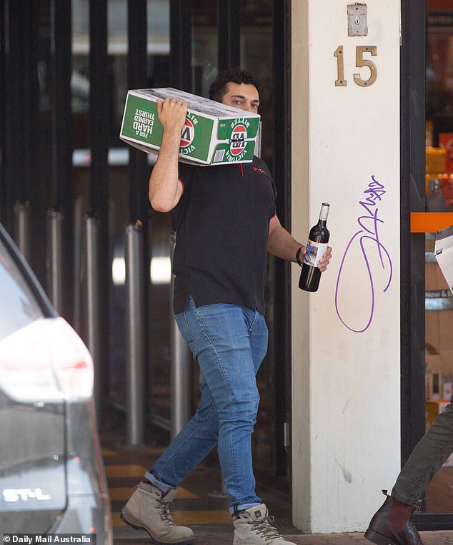 A second glass of beer or wine can have serious effects on your vision and accelerate the risk of age-related macular degeneration.  In the photo an Australian appears stocking up on alcohol.