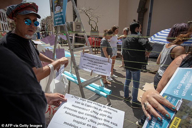Activists began a hunger strike on April 11 to demand a moratorium on mass tourism in the Canary Islands (pictured: members of the 'Canaria se exhausts' movement at a protest in Tenerife on April 13)