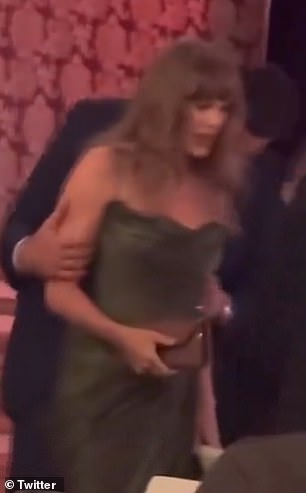 Travis Kelce kisses Taylor Swift on the shoulder