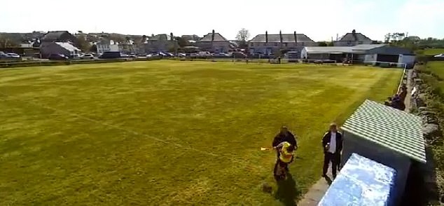 The Amlwch staff figure then punches the volunteer linesman in the face and knocks him to the ground.