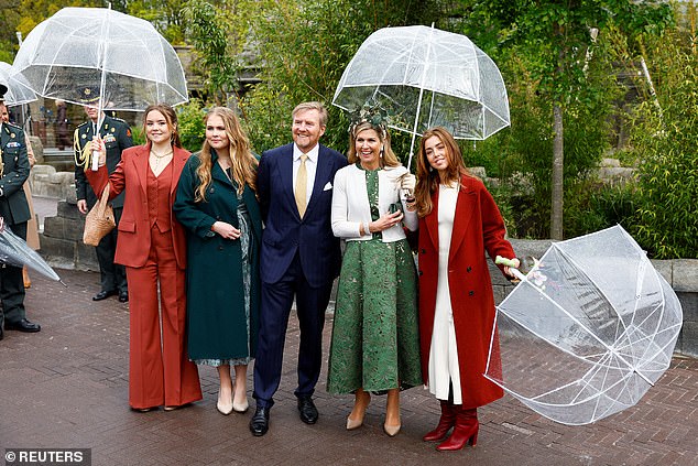 Dutch royal family poses with umbrellas while celebrating King's Day