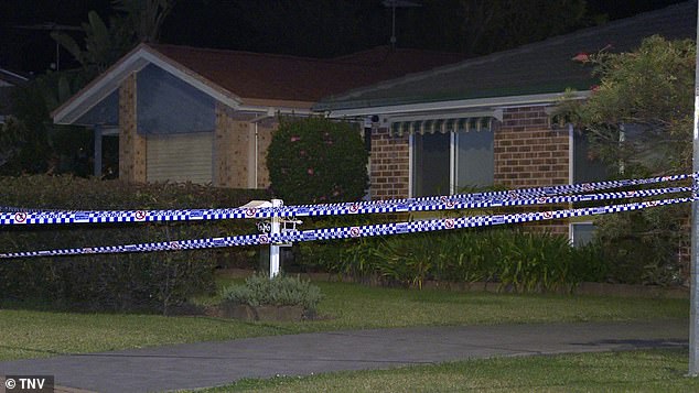 Officers have established a crime scene outside the home in Sydney's southwest.