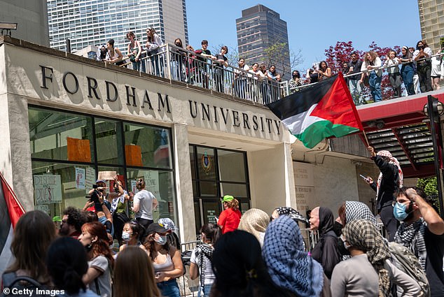Ro-Palestinian protesters gather outside Fordham's Lincoln Center campus after a group created an encampment inside the building on May 1, 2024 in New York City.
