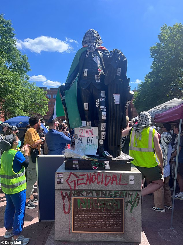 Students painted the historic statue of Washington and stamped a new nickname for GWU on the pedestal: 'Genocidal Warmongering University.'