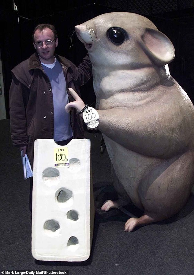 Pictured: Brent Pollard with the 6ft Millennium Dome hamster for which he paid £3,000 at an auction in Kent, 2001.