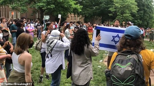 One person was seen carrying an Israeli flag while others threw objects and water at him while the group held the flag high so it would not touch the ground.