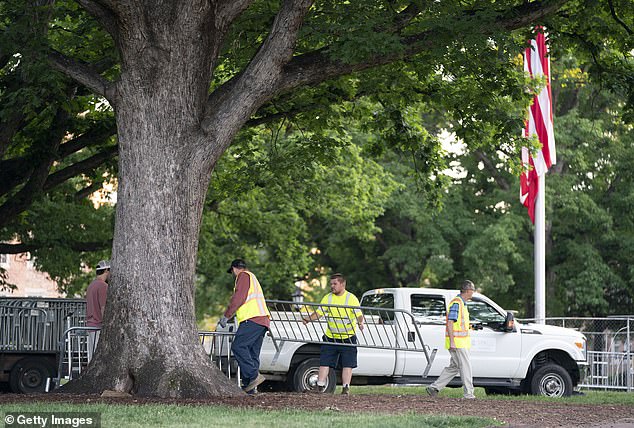 Workers set up barricades at Polk Place at the University of North Carolina on May 1.