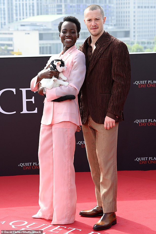 Lupita was joined at the photocall by her co-star Joseph Quinn, who looked dapper in a dark brown jacket with a matching shirt and tan pants.