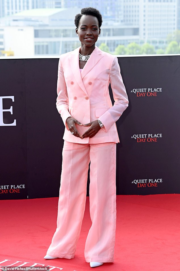 Lupita looked chic for the event as she donned a baby pink jacket along with a pair of matching pants.