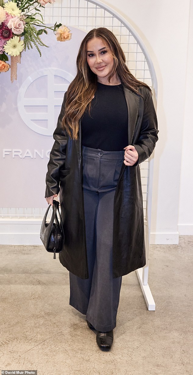Married At First Sight star Cathy Evans, 30 (pictured), also made an appearance, dressed in gray trousers over a black shirt and leather trench coat.
