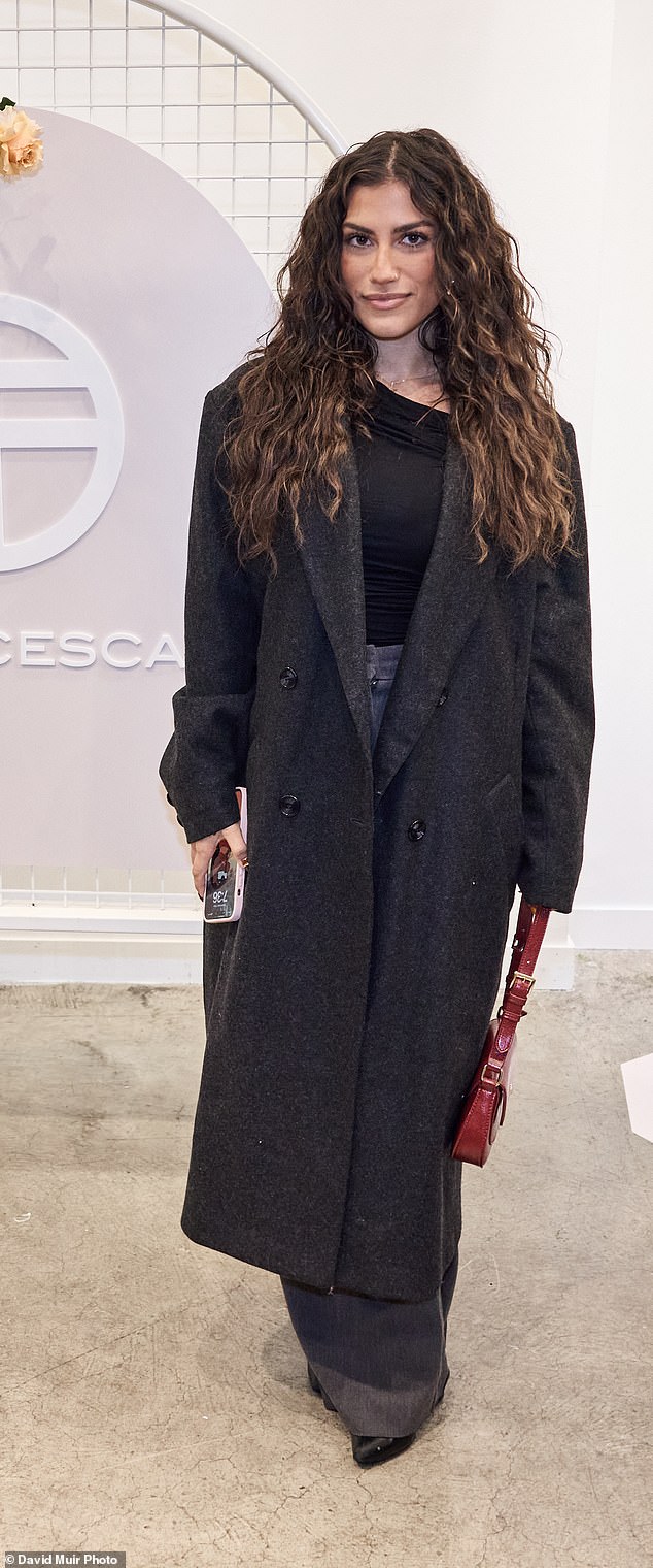 Love Island stars Claudia Bonifazio, 25 (pictured) and Phoebe Spiller, 24, stepped out in casual looks with Claudia wearing an all-black look with a bright red bag.