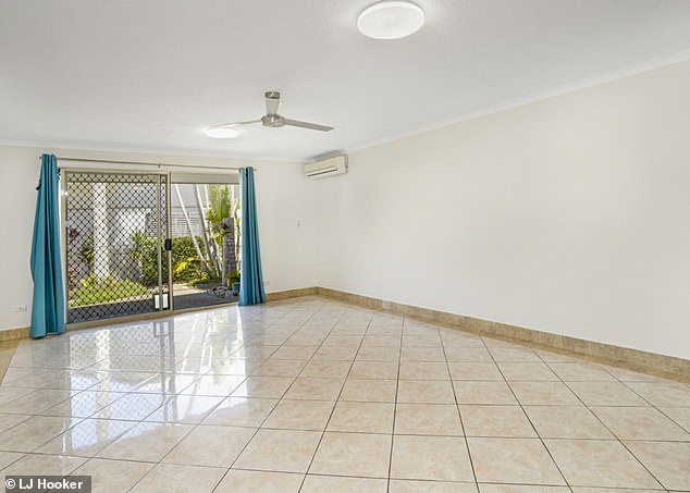Apartment features include a spacious open plan layout and a large patio off the main living area.