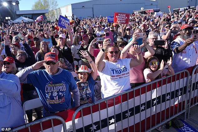 Supporters react as Republican presidential candidate former President Donald Trump speaks at a campaign rally in Freeland, Michigan, on May 1.