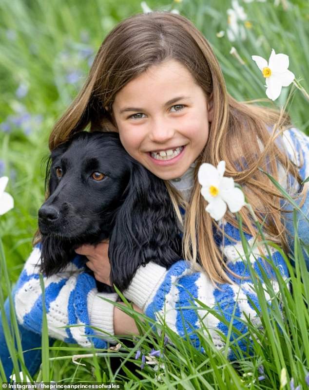 Last year, Charlotte was photographed cuddling her spaniel Orla for her birthday photo.