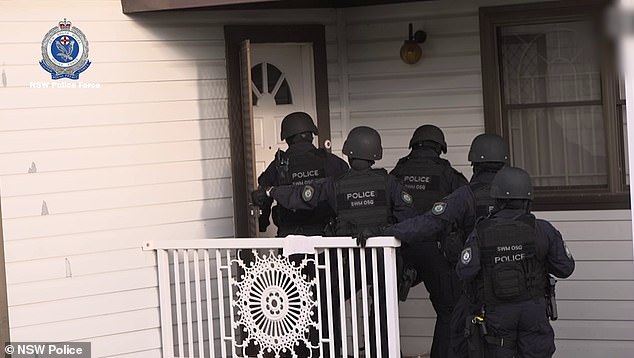 Dozens of officers raid Fairfield West home in south-west Sydney