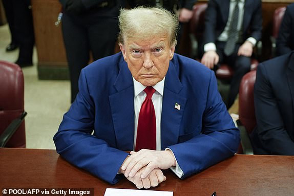 TOPSHOT - Former US President Donald Trump looks on in the courtroom during his trial for allegedly covering up hush payments related to extramarital affairs, in New York City, April 30, 2024. Trump, 77 years, is accused of falsifying business records to reimburse his lawyer, Michael Cohen, for a $130,000 hush payment made to porn star Stormy Daniels just days before the 2016 election against Hillary Clinton.  (Photo by Seth Wenig/POOL/AFP) (Photo by SETH WENIG/POOL/AFP via Getty Images)