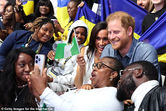 Prince Harry and Meghan Markle take selfies with fans during the Invictus Games Dusseldorf in Germany last September, where they engaged in conversation with Chief of the Defense Staff General Christopher Gwabin Musa.