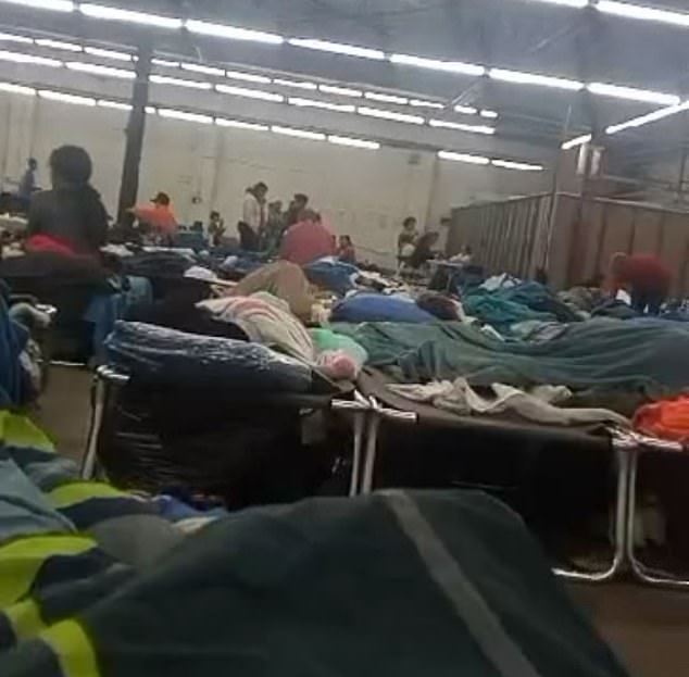 Migrants photographed at a makeshift shelter in Chicago's Pilsen neighborhood, where many are being transferred.  There has been an outbreak of measles and tuberculosis linked to the shelter.