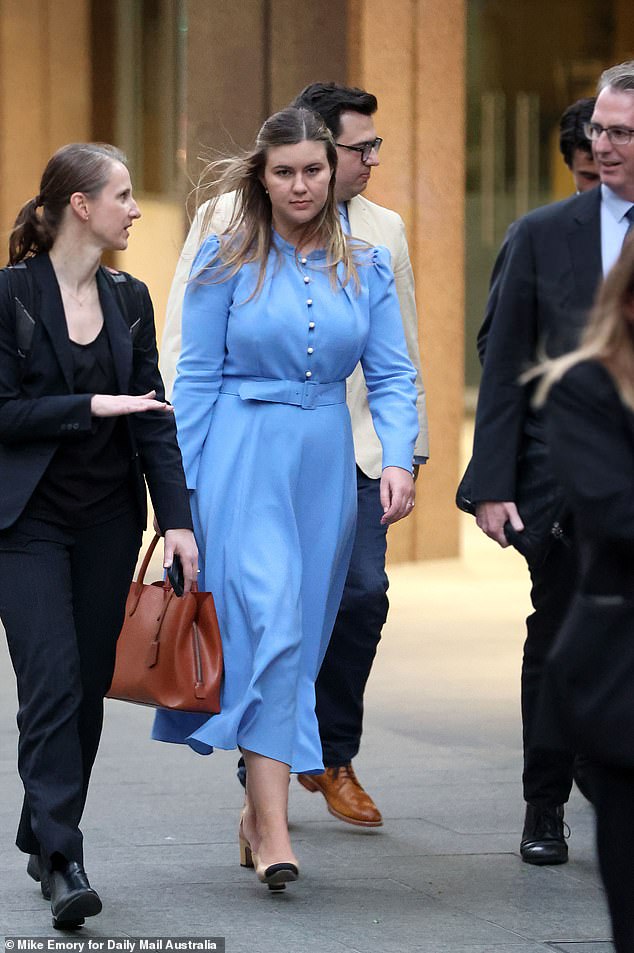 Brittany Higgins appears dressed in blue outside court in March.  In 2021, she told The Project that she was raped by Bruce Lehrmann.