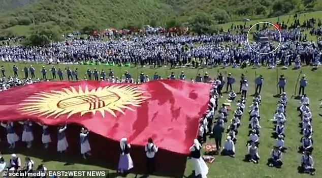 The shocking incident was captured on video from several angles, including a drone hovering above the crowd as some children held a large Kyrgyzstan flag.  The trick is seen moments after passing through a group of people.