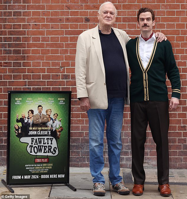 Cleese and Jackson-Smith posing outside the Apollo Theater in central London.  It has been 50 years since the first program was recorded at the BBC studios in December 1974.