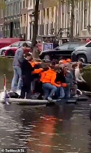 A boat packed with revelers plummeted when they tilted their boat too far as they paused toward dry land.