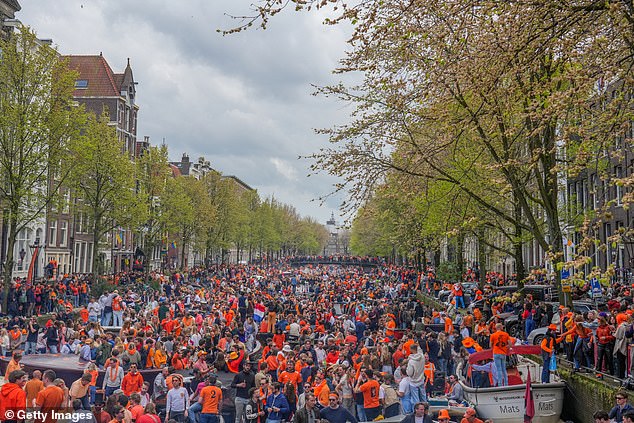 Many of Amsterdam's citizens flock to its 75 kilometers of canals to celebrate the day.