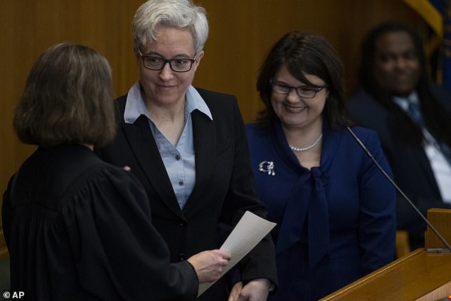Kotek (pictured left) said he is awaiting direction from the Oregon Government Ethics Commission to more clearly define the long-term role of his wife (pictured right).