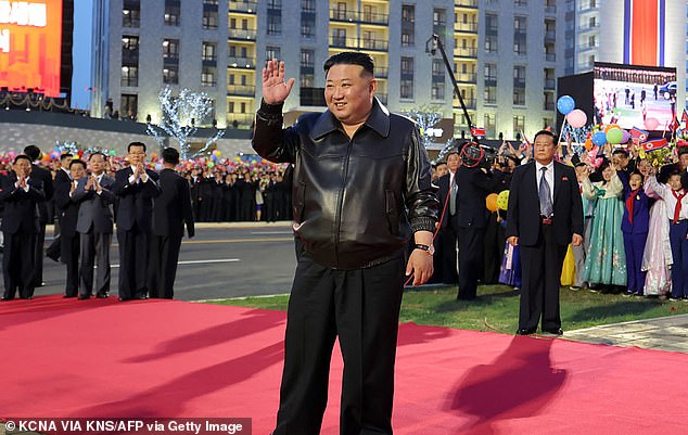 North Korean leader Kim Jong Un (center) participating in a red carpet ceremony to commemorate the completion of the second phase of a 10,000-unit housing development in Pyongyang.