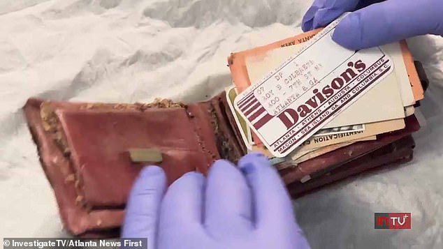 The dust-covered red leather heirloom was removed and handed to his daughter.